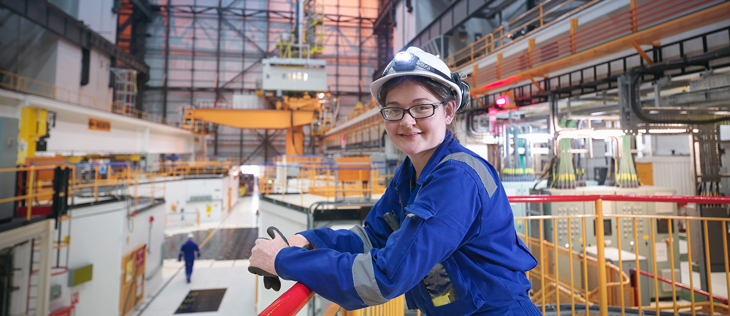Women smiling in facility on cat walk