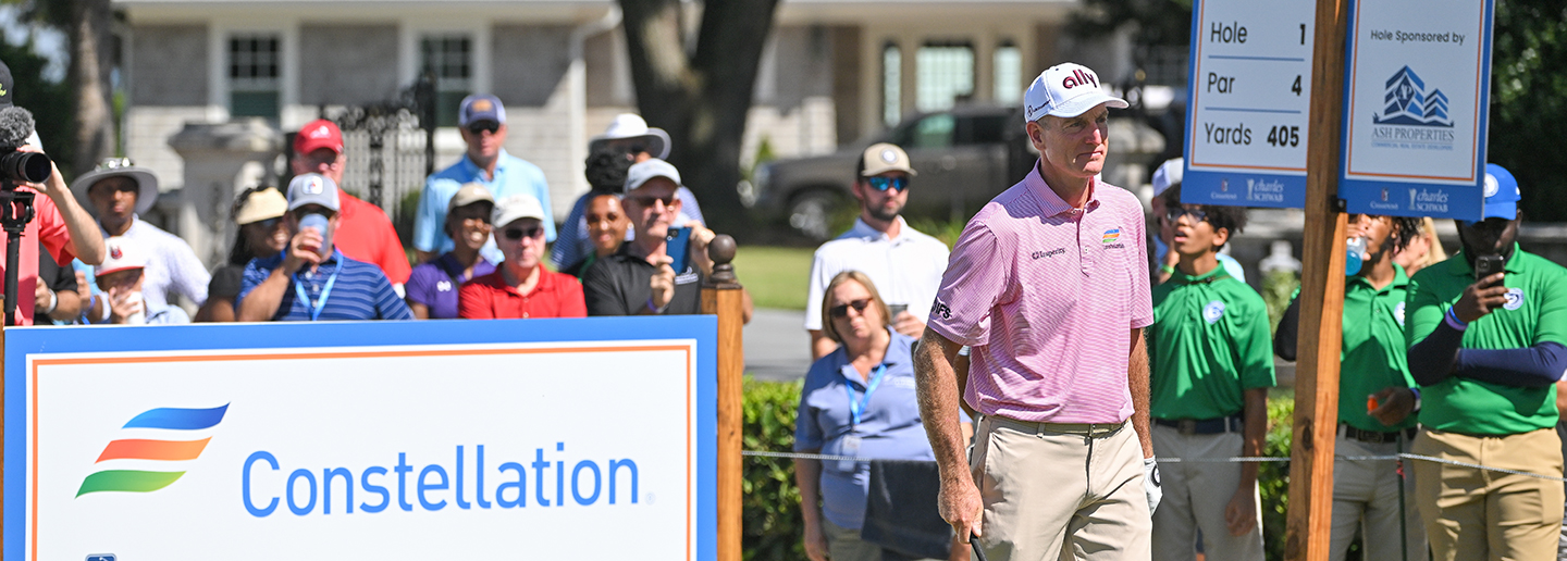 Furyk & Friends golf tournament with Jim Furyk walking off the tee, sponsored by Constellation