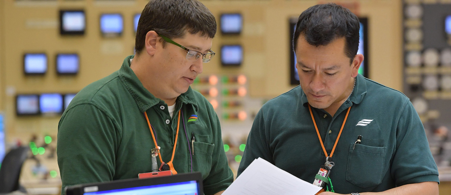 Two men looking at files